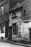 Fruit Baskets Piled Against Houses at Borough Market, London, 1926-1927-Whiffin-Giclee Print