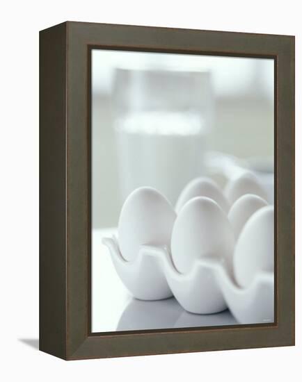 White Eggs in an Egg Holder-Alena Hrbkova-Framed Premier Image Canvas