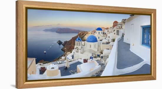 White Houses and Blue Domes of the Churches Dominate the Aegean Sea, Oia, Santorini-Roberto Moiola-Framed Premier Image Canvas