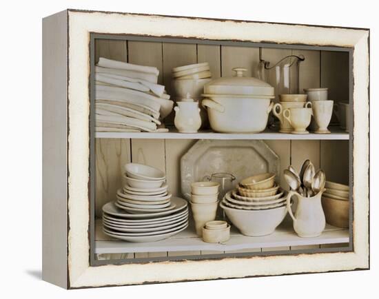 White Tableware and Table Cloths on a Kitchen Shelf-Ellen Silverman-Framed Premier Image Canvas