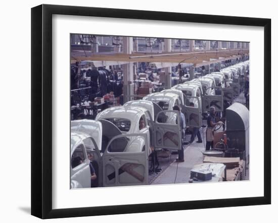 White Volkswagens Coming Down Assembly Line in Brazilian Factory-Paul Schutzer-Framed Photographic Print