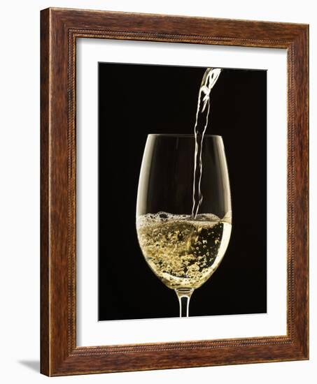 White Wine Pouring from Bottle into Glass-John Hay-Framed Photographic Print