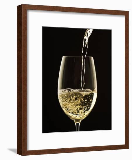 White Wine Pouring from Bottle into Glass-John Hay-Framed Photographic Print