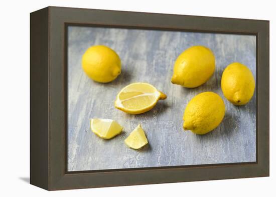 Whole and Sliced Lemons on Grey Subsoil-Jana Ihle-Framed Premier Image Canvas