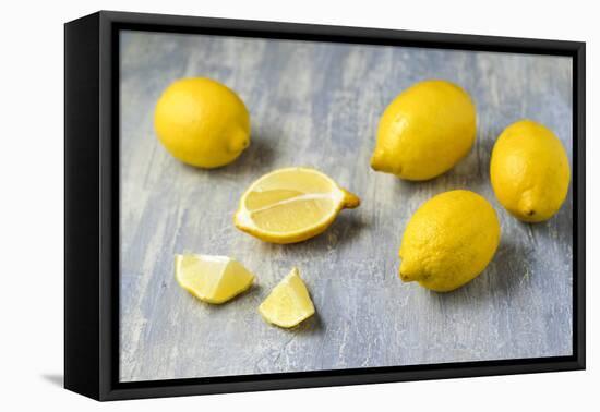 Whole and Sliced Lemons on Grey Subsoil-Jana Ihle-Framed Premier Image Canvas