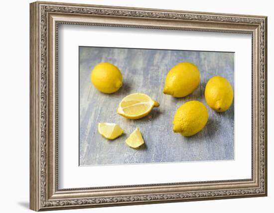 Whole and Sliced Lemons on Grey Subsoil-Jana Ihle-Framed Photographic Print