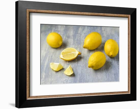 Whole and Sliced Lemons on Grey Subsoil-Jana Ihle-Framed Photographic Print