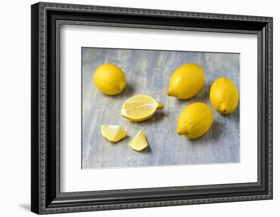 Whole and Sliced Lemons on Grey Subsoil-Jana Ihle-Framed Photographic Print