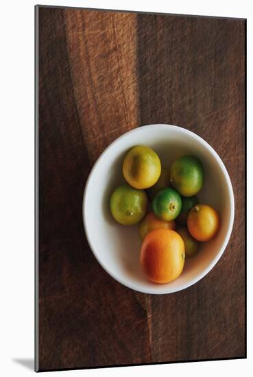 Whole Calamansi Fruit, A Citrus Associated With Filipino Cooking Shown On A Rustic Background-Shea Evans-Mounted Photographic Print