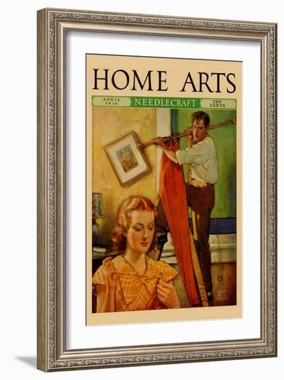 Wife Sews While a Man Hangs a Picture-null-Framed Art Print