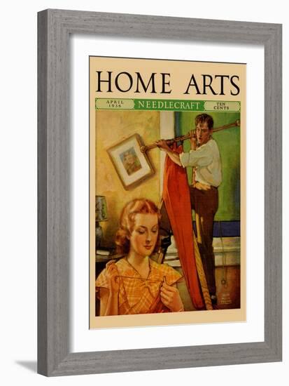 Wife Sews While a Man Hangs a Picture-null-Framed Art Print