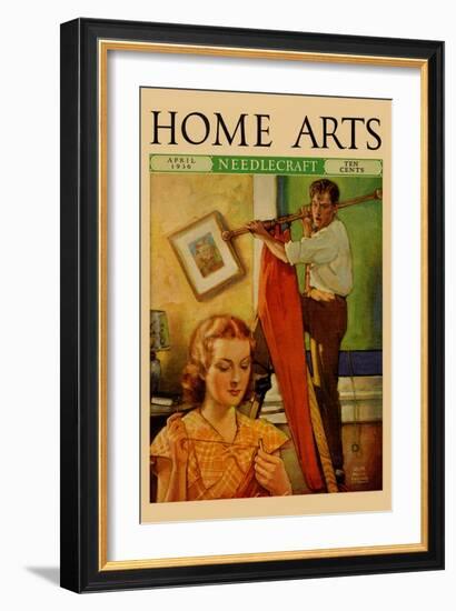 Wife Sews While a Man Hangs a Picture-null-Framed Art Print