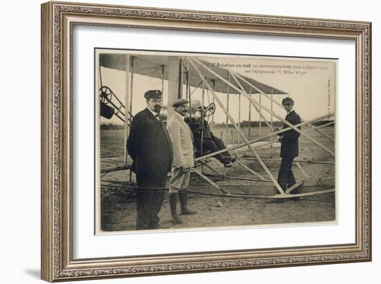 Wilbur Wright Makes a Last Minute Check Before Taking to the Air with a Passenger-null-Framed Art Print