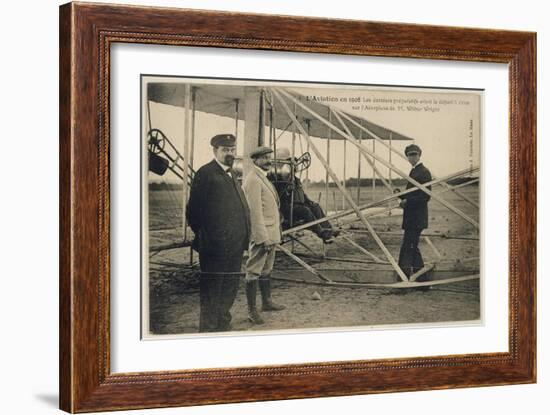 Wilbur Wright Makes a Last Minute Check Before Taking to the Air with a Passenger-null-Framed Art Print