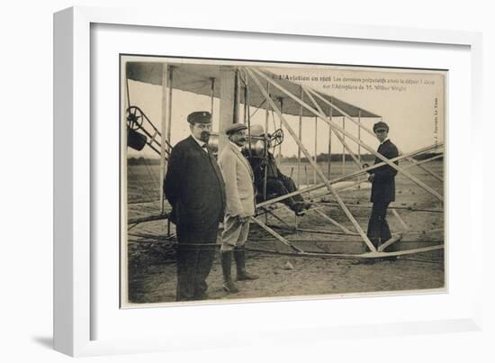 Wilbur Wright Makes a Last Minute Check Before Taking to the Air with a Passenger-null-Framed Art Print