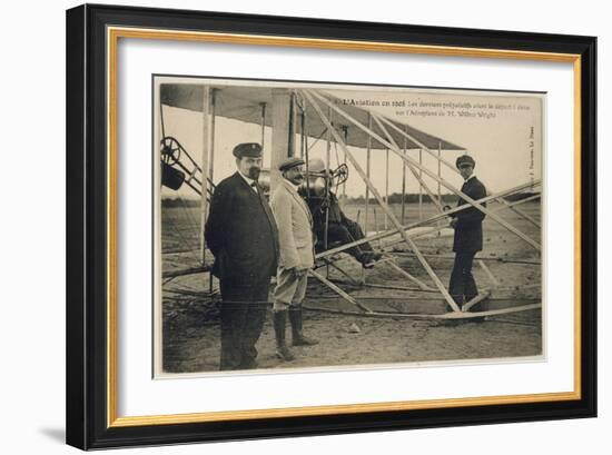 Wilbur Wright Makes a Last Minute Check Before Taking to the Air with a Passenger-null-Framed Art Print