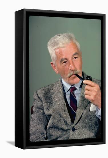 William Faulkner Smoking a Pipe-Carl Mydans-Framed Premier Image Canvas