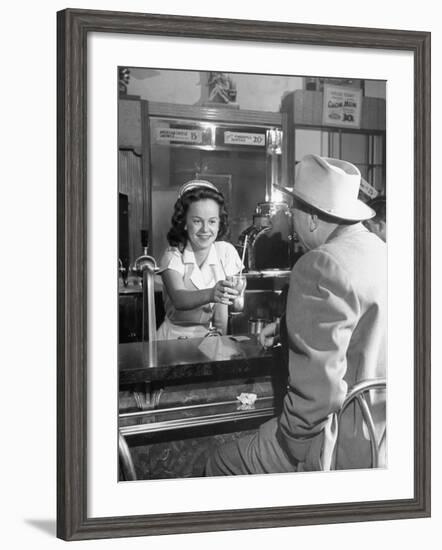 William O. Douglas's Daughter Serving Him a Soda at the Drugstore-null-Framed Photographic Print