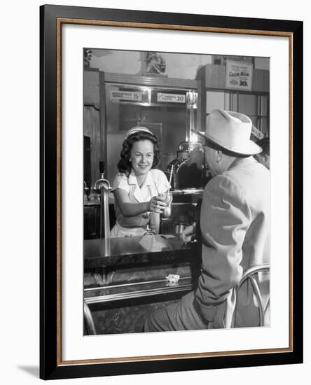 William O. Douglas's Daughter Serving Him a Soda at the Drugstore-null-Framed Photographic Print