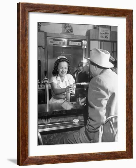 William O. Douglas's Daughter Serving Him a Soda at the Drugstore-null-Framed Photographic Print