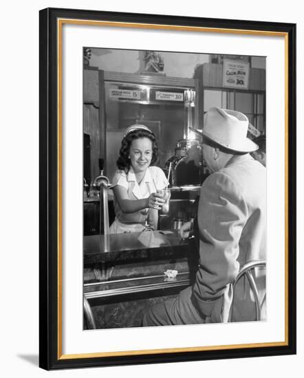 William O. Douglas's Daughter Serving Him a Soda at the Drugstore-null-Framed Photographic Print