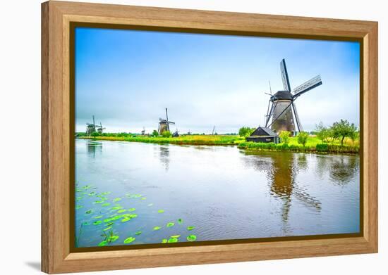 Windmills and Canal in Kinderdijk, Holland or Netherlands. Unesco Site-stevanzz-Framed Premier Image Canvas