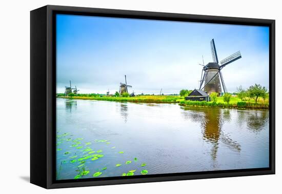 Windmills and Canal in Kinderdijk, Holland or Netherlands. Unesco Site-stevanzz-Framed Premier Image Canvas