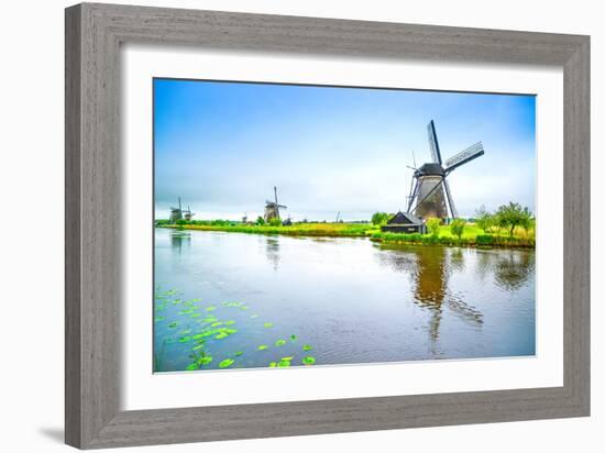 Windmills and Canal in Kinderdijk, Holland or Netherlands. Unesco Site-stevanzz-Framed Photographic Print