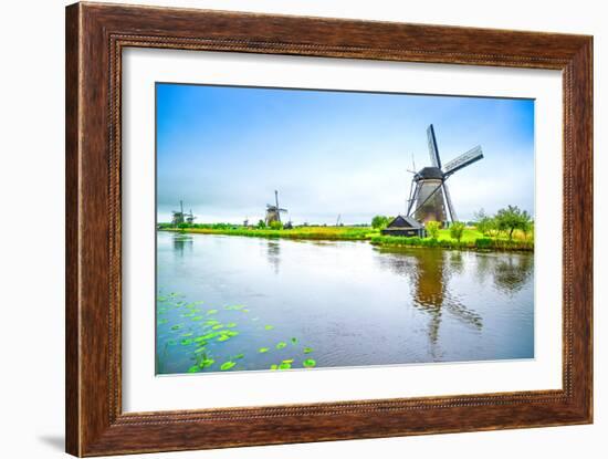 Windmills and Canal in Kinderdijk, Holland or Netherlands. Unesco Site-stevanzz-Framed Photographic Print