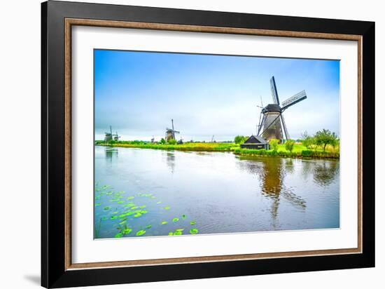 Windmills and Canal in Kinderdijk, Holland or Netherlands. Unesco Site-stevanzz-Framed Photographic Print