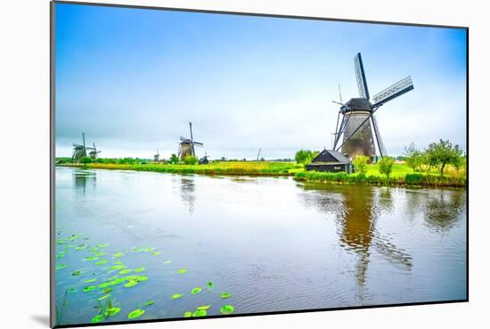 Windmills and Canal in Kinderdijk, Holland or Netherlands. Unesco Site-stevanzz-Mounted Photographic Print