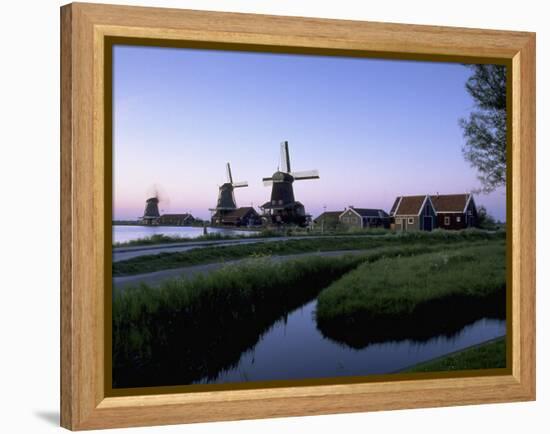 Windmills at Sunset, Zaanstad, North Holland-Walter Bibikow-Framed Premier Image Canvas