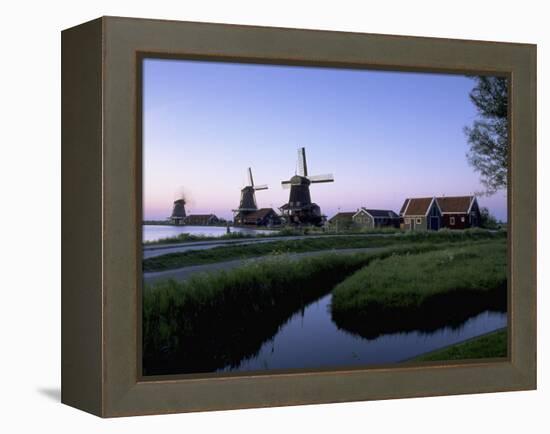 Windmills at Sunset, Zaanstad, North Holland-Walter Bibikow-Framed Premier Image Canvas