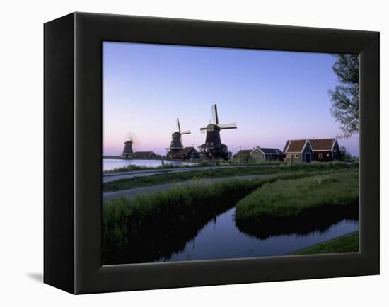 Windmills at Sunset, Zaanstad, North Holland-Walter Bibikow-Framed Premier Image Canvas
