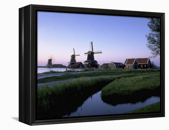 Windmills at Sunset, Zaanstad, North Holland-Walter Bibikow-Framed Premier Image Canvas