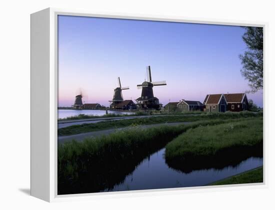 Windmills at Sunset, Zaanstad, North Holland-Walter Bibikow-Framed Premier Image Canvas