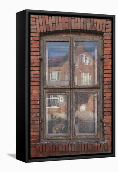 Window in a rowhouse in Wislica, Poland with reflections from the home across the street.-Mallorie Ostrowitz-Framed Premier Image Canvas