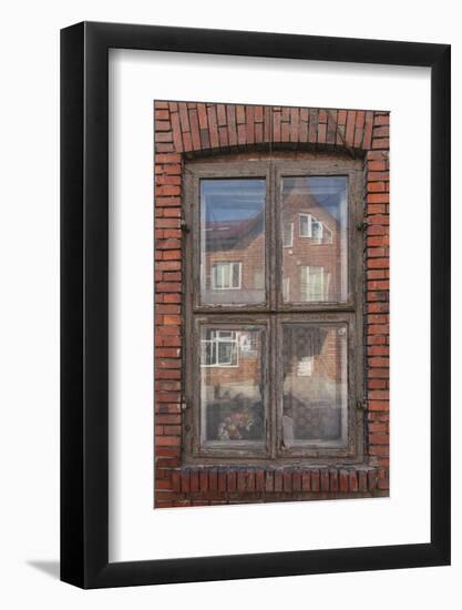 Window in a rowhouse in Wislica, Poland with reflections from the home across the street.-Mallorie Ostrowitz-Framed Photographic Print