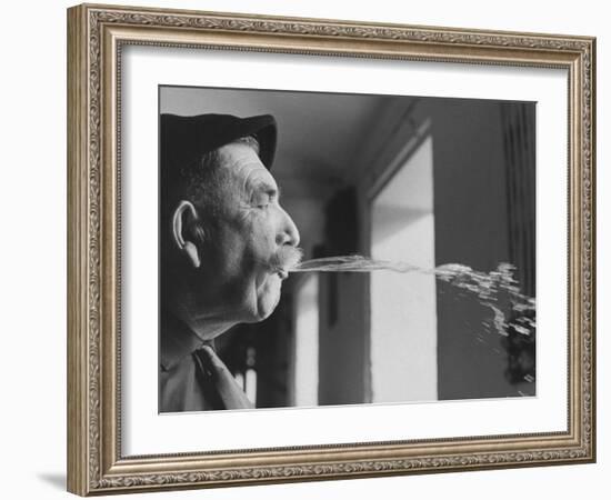 Wine Cellar Master and Taster Spitting Wine-Carlo Bavagnoli-Framed Photographic Print