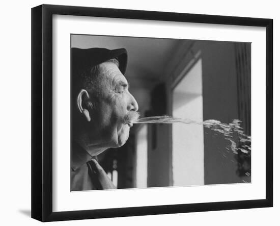 Wine Cellar Master and Taster Spitting Wine-Carlo Bavagnoli-Framed Photographic Print