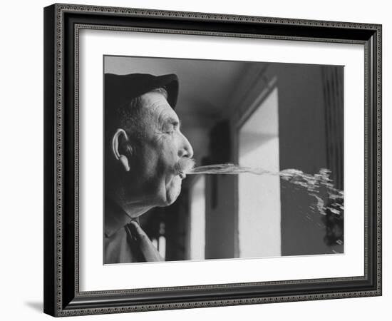 Wine Cellar Master and Taster Spitting Wine-Carlo Bavagnoli-Framed Photographic Print