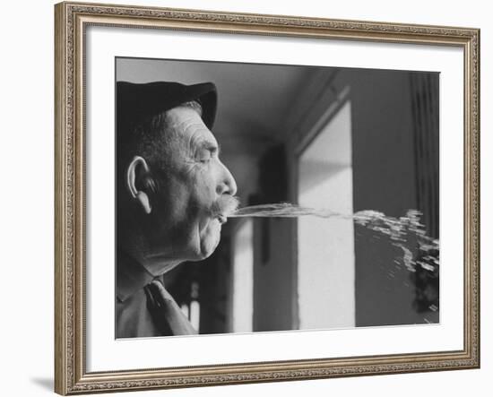 Wine Cellar Master and Taster Spitting Wine-Carlo Bavagnoli-Framed Photographic Print