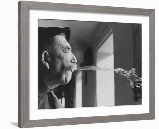 Wine Cellar Master and Taster Spitting Wine-Carlo Bavagnoli-Framed Photographic Print