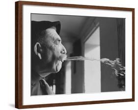 Wine Cellar Master and Taster Spitting Wine-Carlo Bavagnoli-Framed Photographic Print
