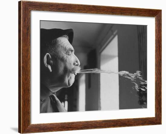 Wine Cellar Master and Taster Spitting Wine-Carlo Bavagnoli-Framed Photographic Print