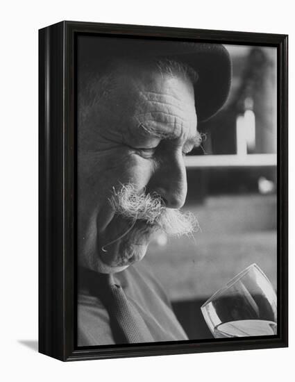 Wine Taster Sniffing Wine Before Tasting It-Carlo Bavagnoli-Framed Premier Image Canvas