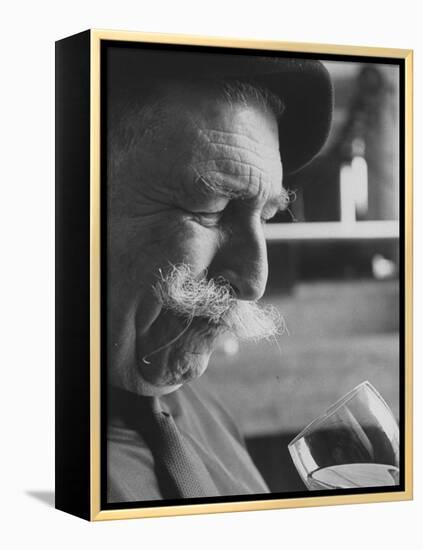 Wine Taster Sniffing Wine Before Tasting It-Carlo Bavagnoli-Framed Premier Image Canvas