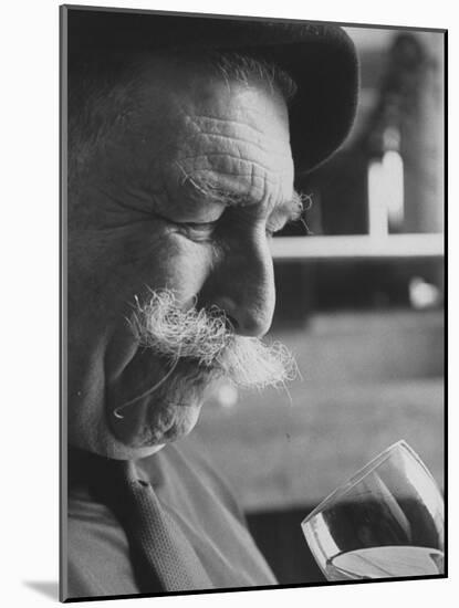 Wine Taster Sniffing Wine Before Tasting It-Carlo Bavagnoli-Mounted Photographic Print