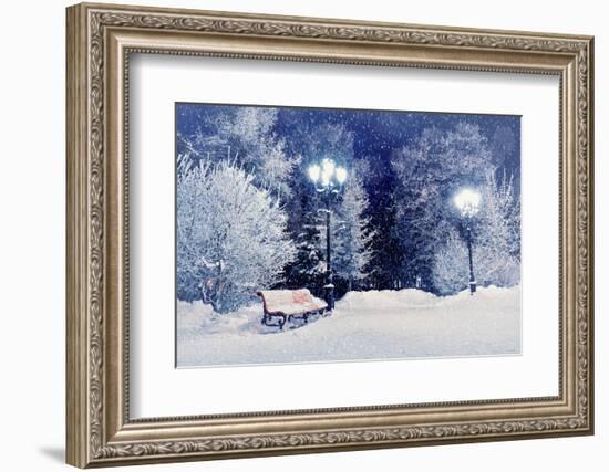 Winter Night Landscape Scene of Snow Covered Bench among Snowy Trees and Shining Lights during Snow-Marina Zezelina-Framed Photographic Print