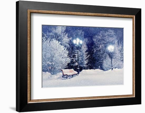 Winter Night Landscape Scene of Snow Covered Bench among Snowy Trees and Shining Lights during Snow-Marina Zezelina-Framed Photographic Print